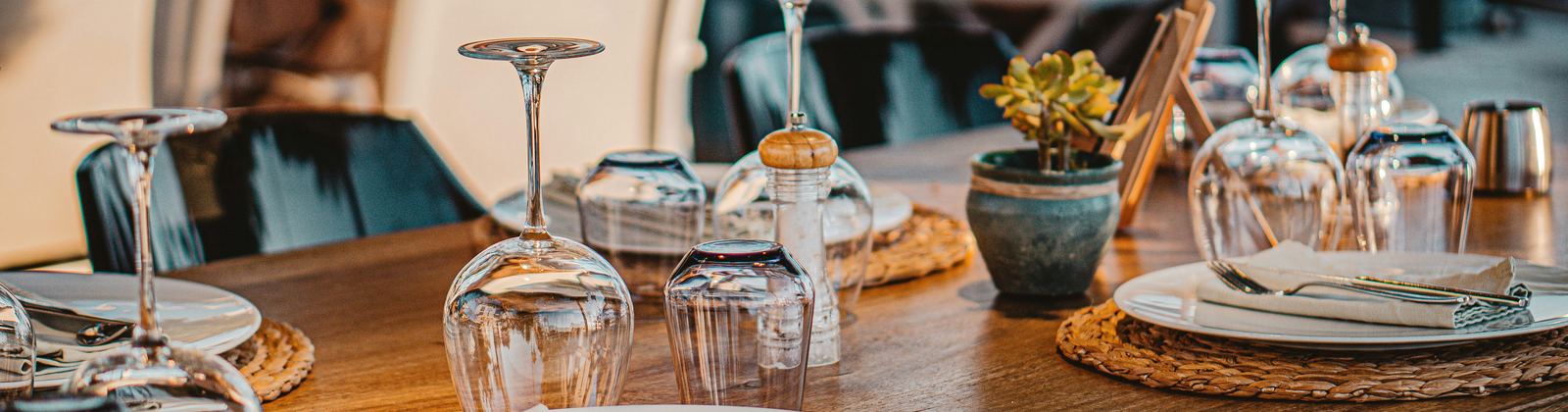 Restaurant table set with glassware and plates