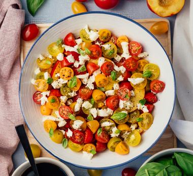 Fresh tomato and herb salad on a table